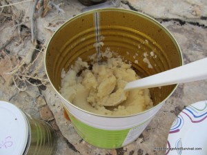 Mixing potatoes in an empty can